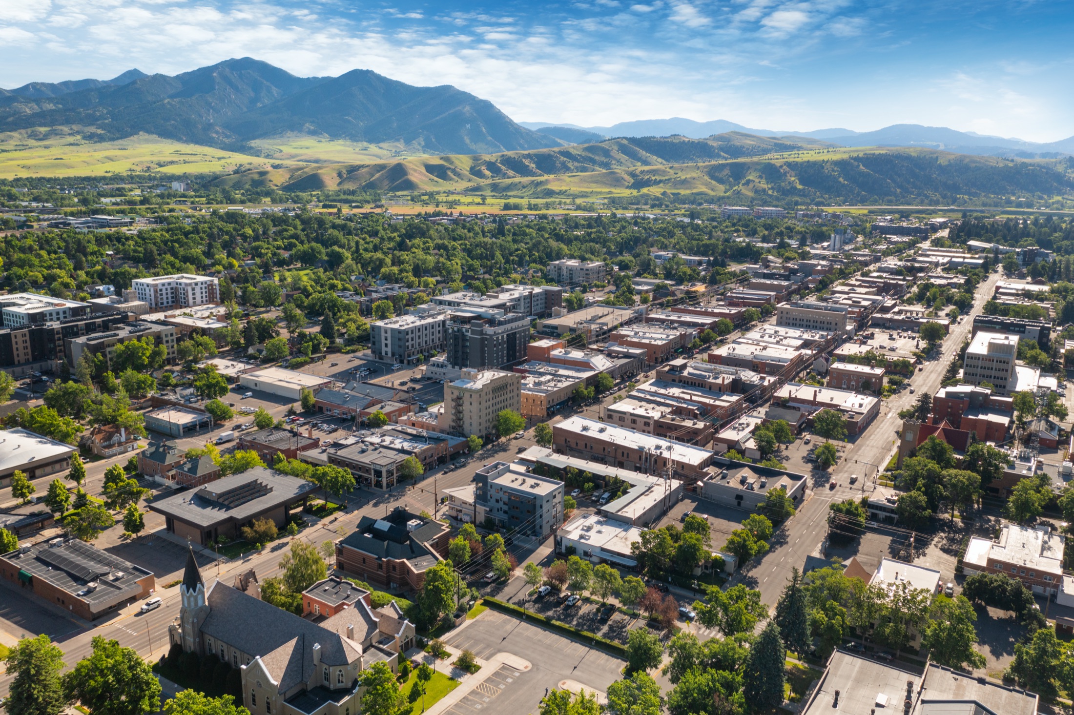 Aerial view of downtown Bozeman with the Bridger Range behind.