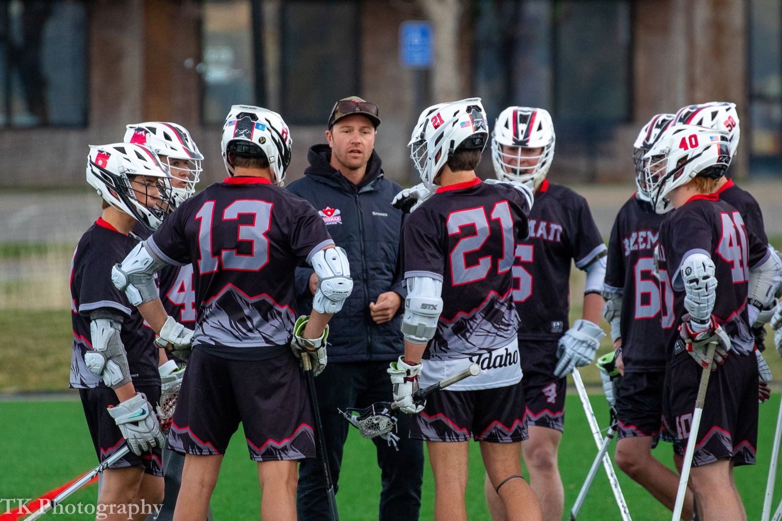 Casey Rose coaching the Bozeman High School varsity lacrosse team.